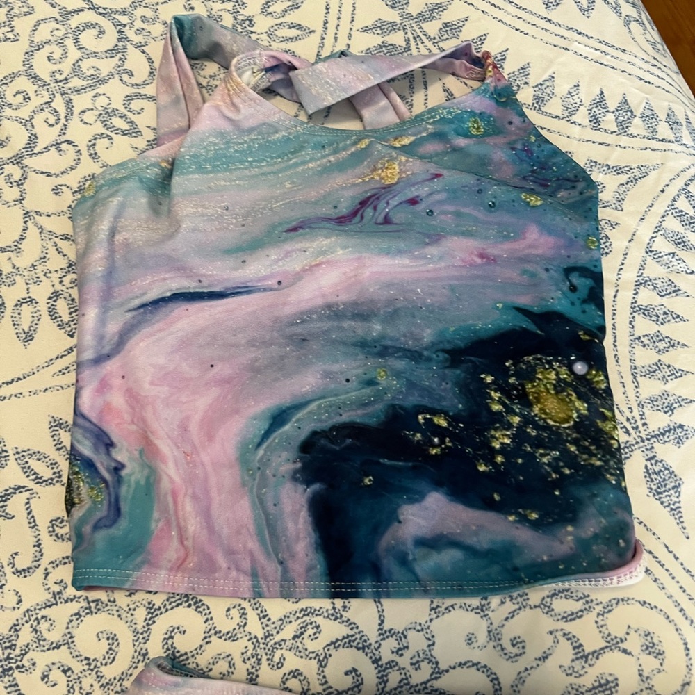Girls 2 piece celestial bathing suit.   Size 10/12.   Never worn